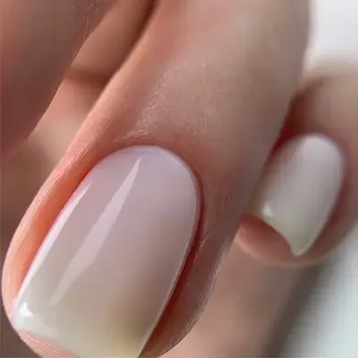 Milky white gel manicure with glossy finish