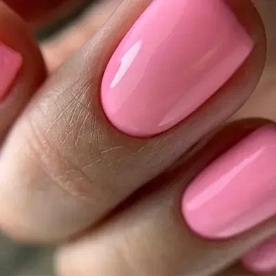 Pink gel manicure on short natural nails