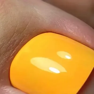 Yellow gel pedicure with glossy finish